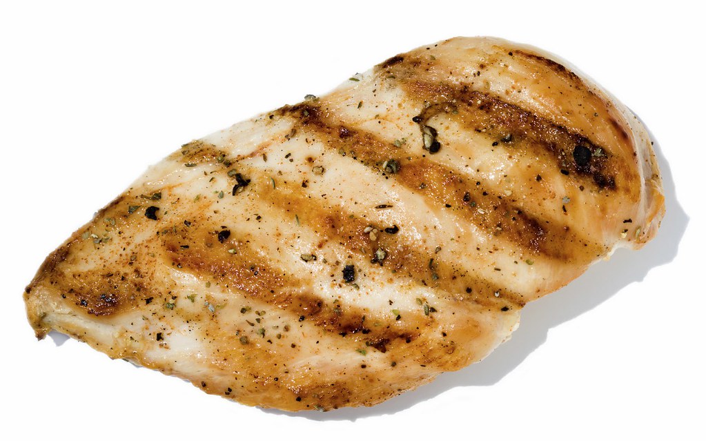 Grilled chicken with a fresh, colorful salad